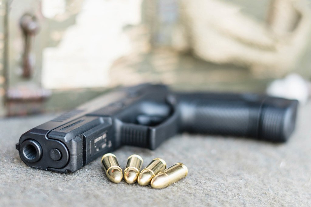 Close Up on Gun And Bullets