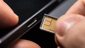 sim-card-being-put-in-phone-136426547804002601-180420081826