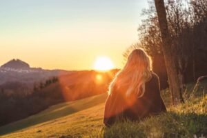 woman sun sunrise field