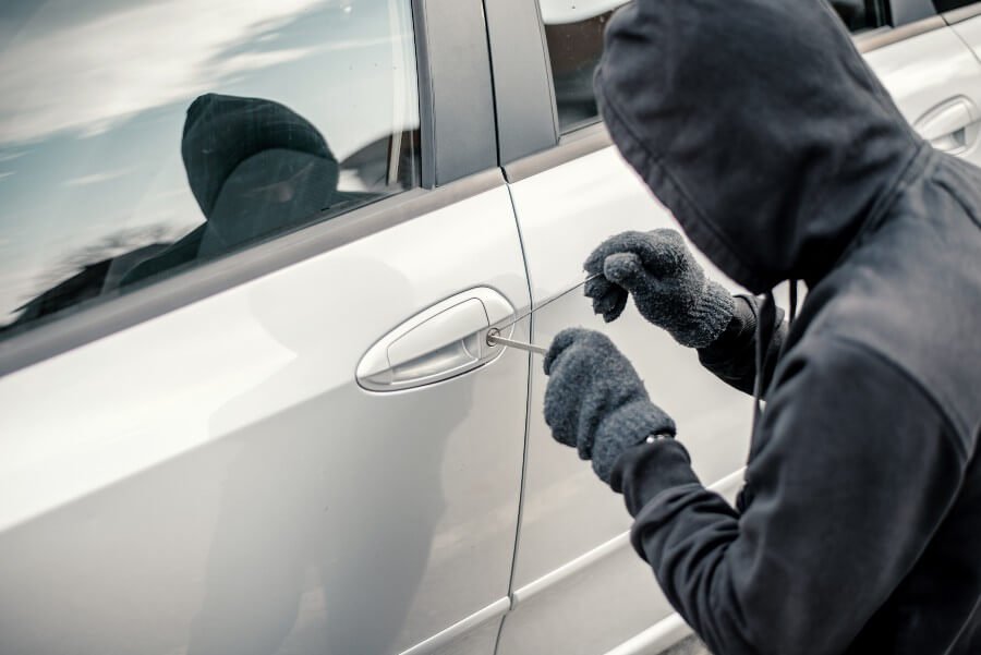 thief-picking-a-car-stealing