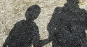 KID shadow-mother-child-holding-